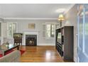 Inviting living room with hardwood floors, fireplace and bright windows at 1908 E Roxboro Ne Rd, Atlanta, GA 30324