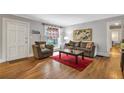 Comfortable living room with hardwood floors, ample seating and natural light at 1908 E Roxboro Ne Rd, Atlanta, GA 30324