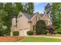 Attractive two-story home with brick and siding, a two-car garage, and mature landscaping at 2759 Thomashire Trce, Marietta, GA 30066