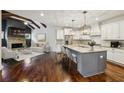 Modern eat-in kitchen with granite countertops, stainless appliances, and an island at 3705 Williams Point Dr, Cumming, GA 30028