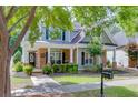Charming two-story home with beautifully landscaped yard at 3900 Baluster Ct, Suwanee, GA 30024