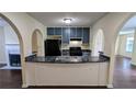 Kitchen with a breakfast bar, dark countertops, and stainless steel sink at 4707 Golod Way, Lithonia, GA 30038