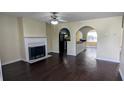 Bright living room with fireplace and arched openings to other rooms at 4707 Golod Way, Lithonia, GA 30038