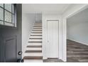 Inviting foyer features stylish wood and white stairs, fresh paint and durable flooring at 2079 Wellborn Rd, Lithonia, GA 30058