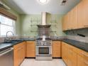 Well-equipped kitchen with stainless steel appliances and a modern backsplash at 1355 E Rock Springs Ne Rd, Atlanta, GA 30306
