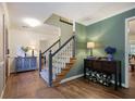 Foyer with hardwood floors and staircase at 2206 Heritage Trace Dr, Marietta, GA 30062