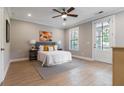 Serene main bedroom with natural light, ceiling fan, neutral tones and access to an outdoor balcony at 671 Brennan Dr, Decatur, GA 30033