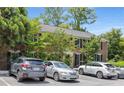 Well-maintained brick condominium with black shutters, lush landscaping, and convenient parking at 1101 Collier Nw Rd # P2, Atlanta, GA 30318
