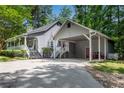 Home with a convenient carport and back entrance accessible by stairs at 3754 Wyntuck Nw Cir, Kennesaw, GA 30152