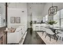 Open-concept living space with modern decor, hardwood floors, and an airy, bright ambiance at 658 Mcgruder Ne St, Atlanta, GA 30312