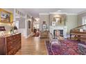 Elegant foyer with hardwood floors, fireplace, high ceilings, and detailed trim work at 15 Northwood Ne Ave, Atlanta, GA 30309