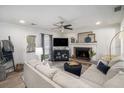 Cozy living room with a brick fireplace, plush seating, and natural light streaming through the windows at 4271 Keheley Ne Rd, Marietta, GA 30066