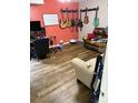 Music room with guitars on wall, comfortable seating, and wood flooring at 120 Alfred Dr, Carrollton, GA 30116