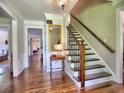 Inviting foyer with hardwood floors, staircase, and elegant trim at 1808 Jacksons Creek Dr, Marietta, GA 30068