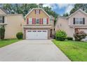 Charming two-story home with a two car garage and well-maintained lawn and an inviting curb appeal at 2165 Capella Cir, South Fulton, GA 30331
