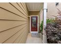 Inviting entryway with a classic front door, elegant sidelight, and meticulously kept landscaping at 2165 Capella Cir, South Fulton, GA 30331