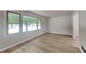 Spacious living room featuring new floors and an abundance of natural light at 1102 Tony Valley Dr, Conyers, GA 30013