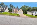 Suburban two-story home with a two-car garage on a landscaped lot at 2428 Harmony Ridge Ct, Lithonia, GA 30058