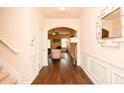 Spacious foyer with hardwood floors, white trim, and archway leading to the living area at 2010 Shortleaf Rd, Fairburn, GA 30213