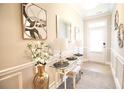 Inviting entryway with elegant decor and a glass console table at 605 Oak Ln, Canton, GA 30114
