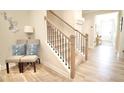 Elegant staircase with wood treads, black railings, and stylish decor at 605 Oak Ln, Canton, GA 30114