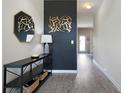 Stylish foyer with modern decor, a sleek console table, and attractive wall art at 303 Horizon Trce, Loganville, GA 30052