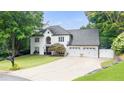 Charming two-story home with a manicured lawn and attached two-car garage at 5286 Wild Indigo Nw Way, Acworth, GA 30102