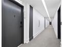 Long hallway with modern lighting and gray carpet in a building at 108 Park Pl # 110, Decatur, GA 30030