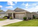 A single-story home with neutral siding, a two-car garage, and a well-maintained lawn, showcasing the property's exterior at 508 Windy Ridge Ct, Canton, GA 30114