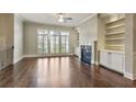 Bright living room with hardwood floors, fireplace, built-in bookshelves, and large windows at 1117 Cordia Ave, Atlanta, GA 30318