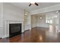 Open-concept living room features a fireplace, built-in shelving and seamless flow at 1117 Cordia Ave, Atlanta, GA 30318