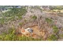 Aerial view of a house nestled within a dense forest at 1452 Redwine Rd, Fayetteville, GA 30215