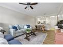 Inviting living room with hardwood floors, ceiling fan, and modern furnishings at 1850 Cotillion Drive # 2118, Dunwoody, GA 30338