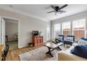 Cozy living room featuring neutral walls, wood flooring, with lots of natural light from large windows at 1850 Cotillion Drive # 2118, Dunwoody, GA 30338