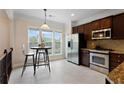 Bright kitchen features stainless steel appliances, tile backsplash, and breakfast nook with large windows at 2367 Millhaven Se St, Smyrna, GA 30080