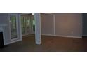 Living room featuring hardwood floors, white trim, and a fireplace at 3828 Woodridge Way, Tucker, GA 30084