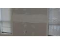 Unfinished room with windows and horizontal blinds with visible wall damage at 3828 Woodridge Way, Tucker, GA 30084