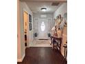 Inviting entryway featuring a front door with decorative glass and stylish decor, creating a welcoming first impression at 791 Bristol Way, Lithonia, GA 30058