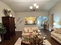 Cozy living room with comfortable seating and stylish decor, perfect for relaxation and entertaining guests at 791 Bristol Way, Lithonia, GA 30058