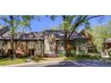 Charming townhouse featuring brick and siding exterior, mature trees, and well-maintained landscaping at 470 Ansley Walk Ne Ter, Atlanta, GA 30309