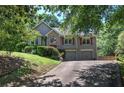 Beautiful two-story home with lush green lawn, two car garage, and charming curb appeal at 263 Bennett Farms Trl, Acworth, GA 30102