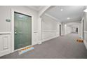Hallway view with unit 2303 and sunflower welcome mat at 2303 Stratford Commons Commons, Decatur, GA 30033