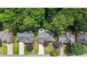 Aerial view of the property surrounded by mature trees and manicured lawns at 4955 Day Lily Nw Way, Acworth, GA 30102