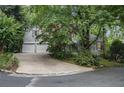 Beautiful home exterior with a two-car garage and lush landscaping at 80 Stratford Ne Pl, Atlanta, GA 30342