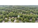 Aerial view of the neighborhood surrounded by lush green trees at 878 Treadstone Overlook, Suwanee, GA 30024
