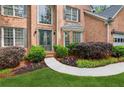 Stunning front entry with double doors and manicured landscaping at 878 Treadstone Overlook, Suwanee, GA 30024