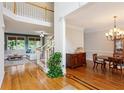 Bright living room with hardwood floors and staircase to the second level at 878 Treadstone Overlook, Suwanee, GA 30024