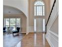 Grand foyer featuring high ceilings, hardwood floors, and a staircase at 2765 Turning Leaf Dr, Lawrenceville, GA 30044
