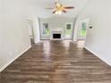 Spacious living room features a fireplace, stylish flooring, and ample natural light at 1102 Ola Dale Ct, Mcdonough, GA 30252