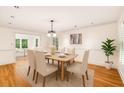 Elegant dining room featuring hardwood floors, natural light and contemporary decor at 1151 Roxboro Ne Cv, Atlanta, GA 30324